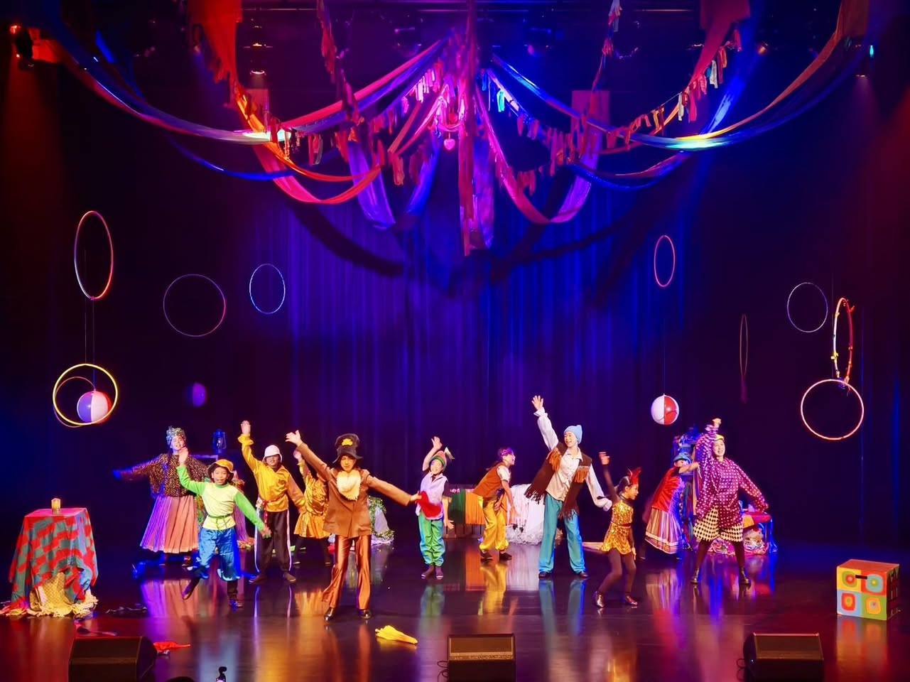 Actors performing on stage during 'Scrooge'