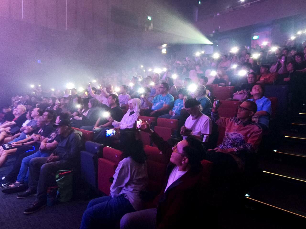 Cradle performing live on stage at the Festive Arts Theatre