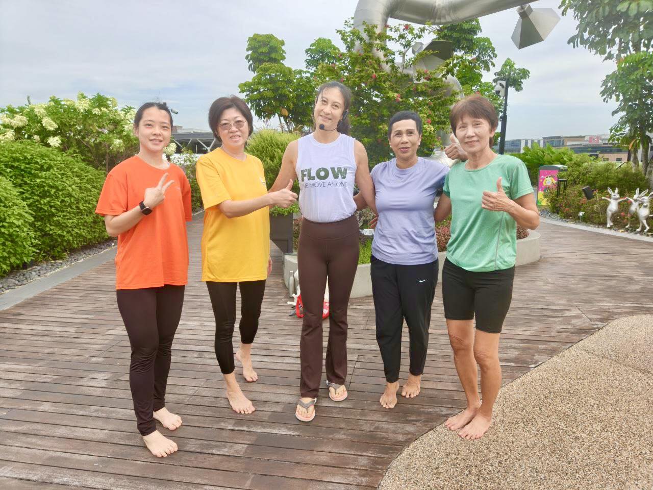 A yoga instructor leading an outdoor class with focus and grace