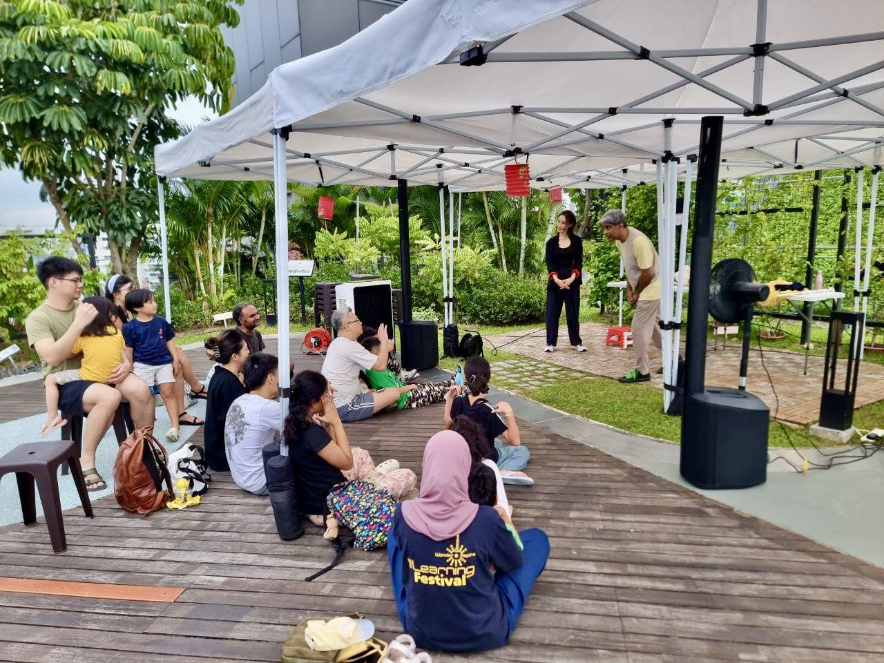 Families enjoying the magical atmosphere of the Stories from the Garden event.