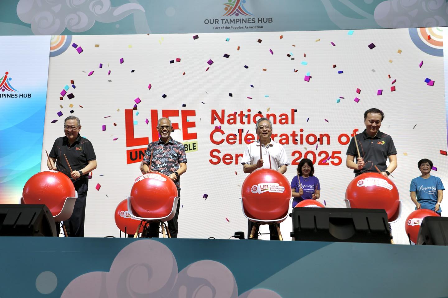 Seniors engaging in a cooking demonstration at the event