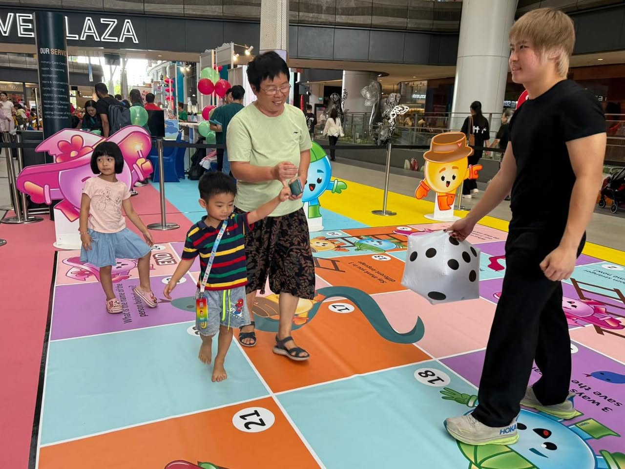 Families participating in interactive games and workshops