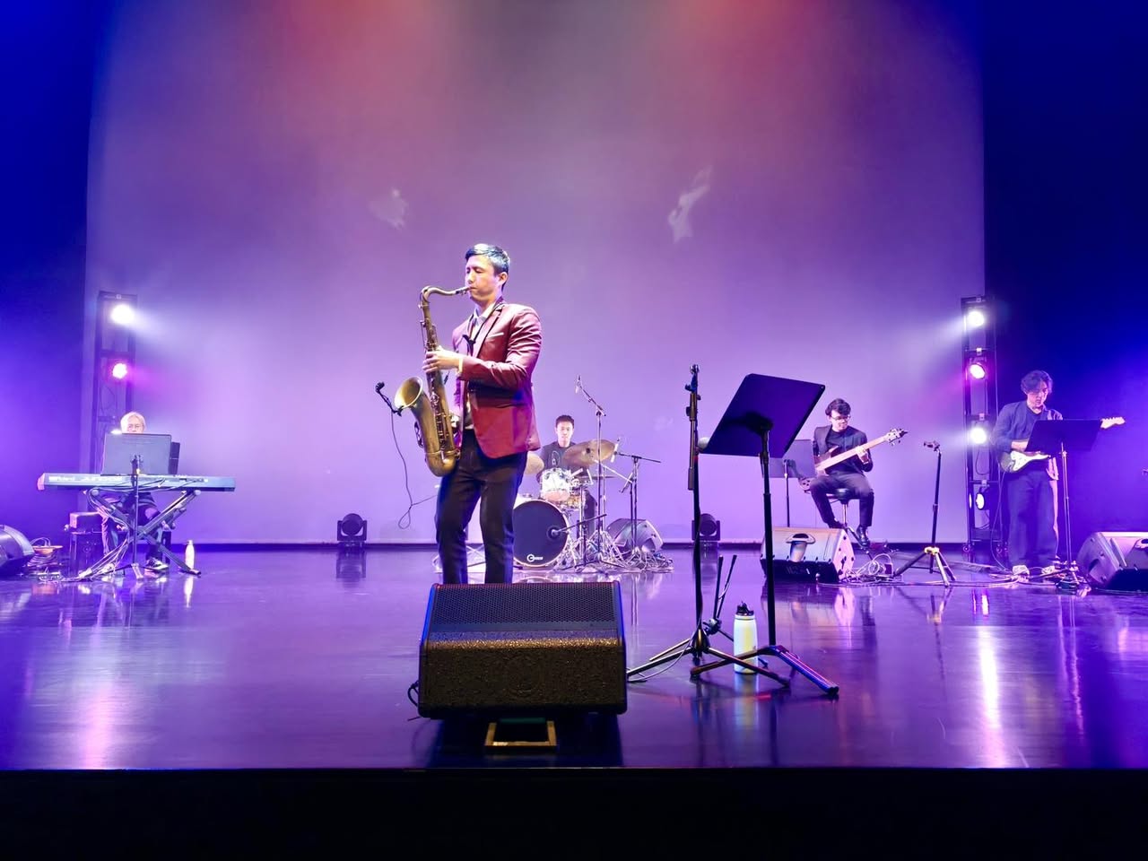 Festive Arts Theatre stage illuminated during the jazz concert