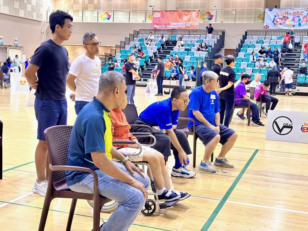 SPS Mr. Eric Chua interacting with a boccia participant