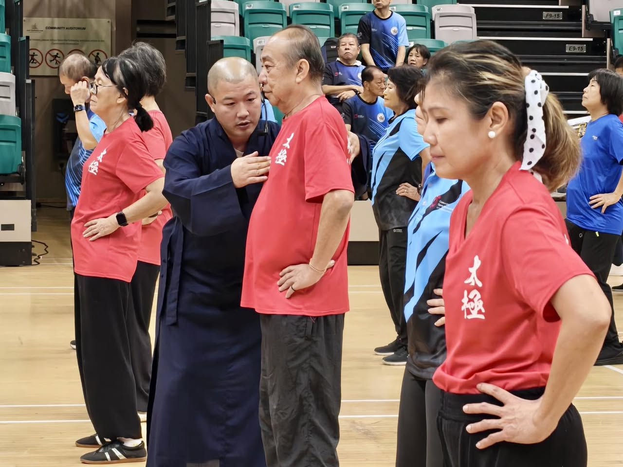 Participants practicing Qigong for health and mindfulness