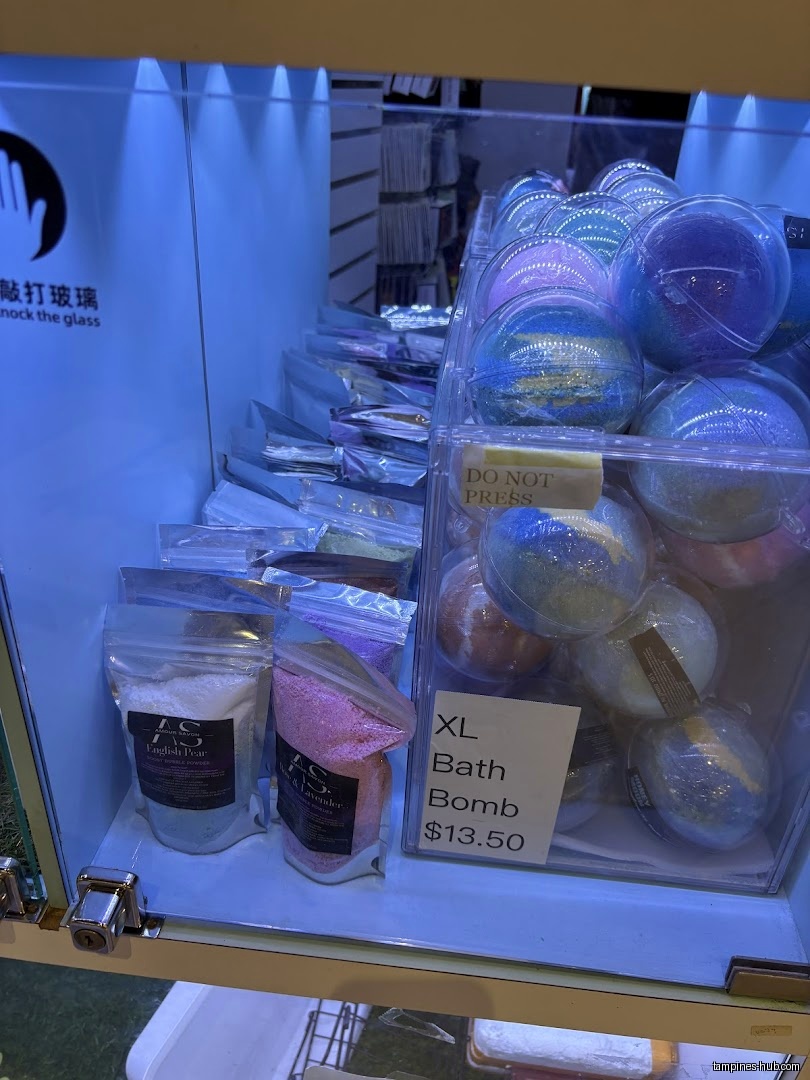 A display case with bath bombs and bath salts for sale.