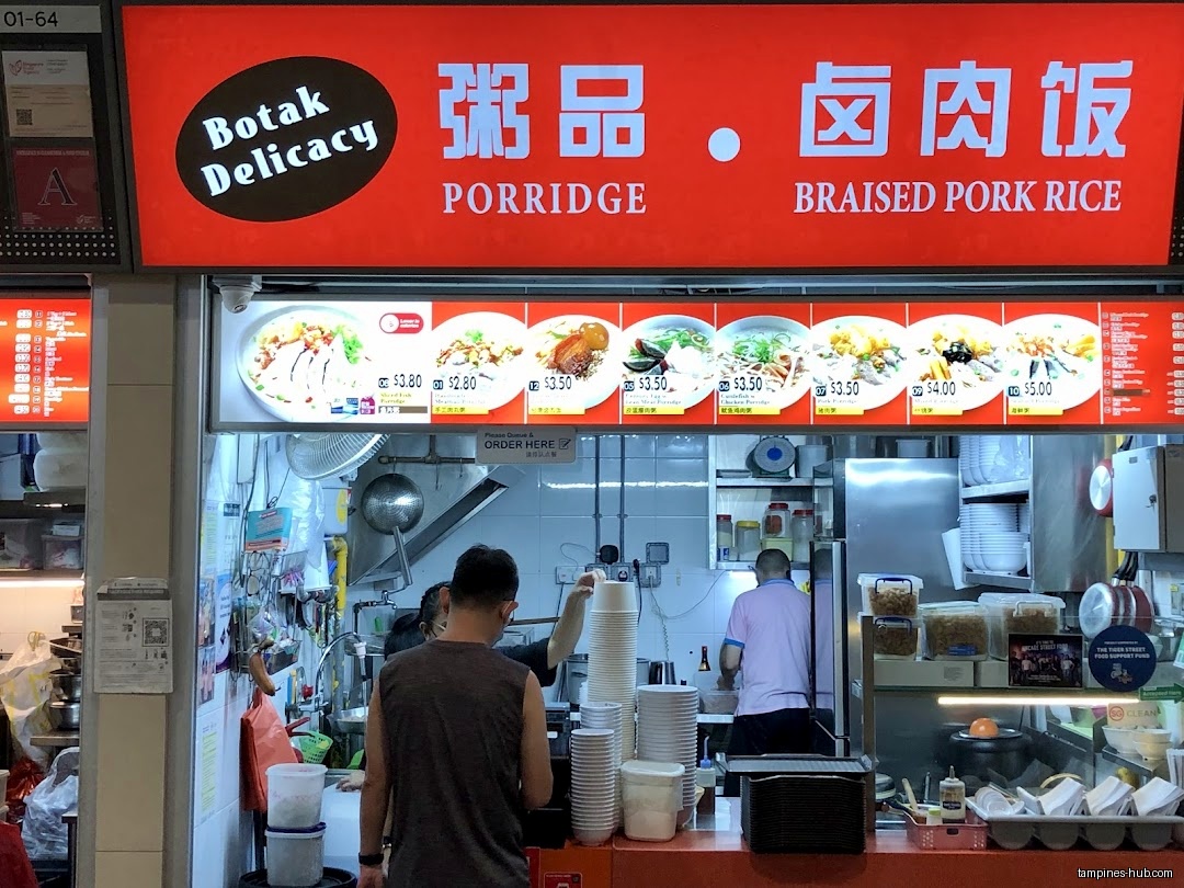 Botak Cantonese Porridge menu board showing porridge and braised pork rice dishes.