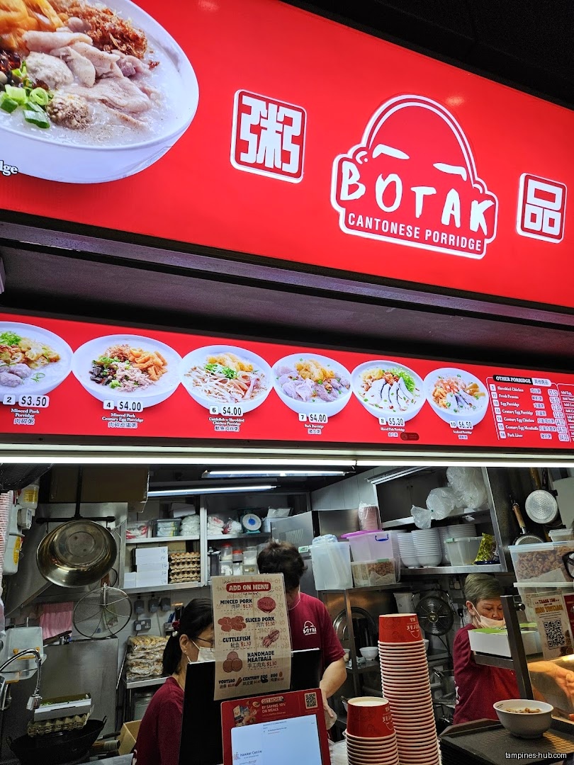 Botak Cantonese Porridge shop with menu board and staff visible.