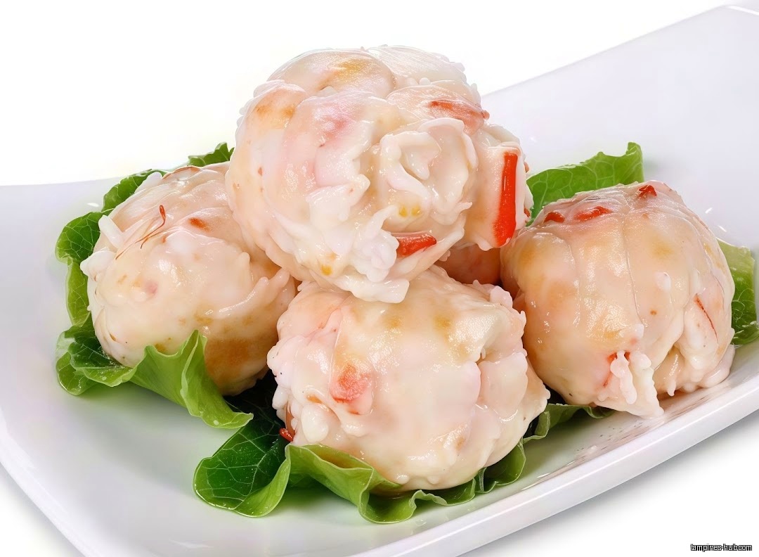A plate of shrimp balls with lettuce garnish, likely for hotpot.