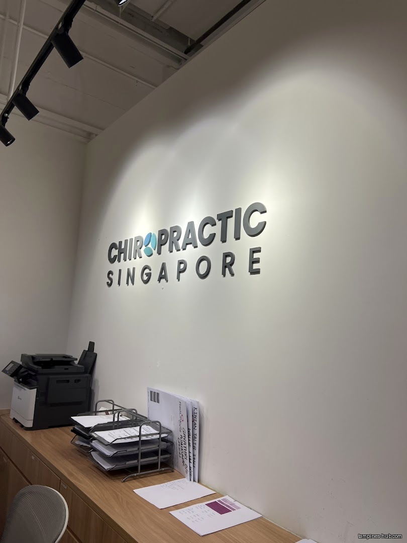 Interior view of Chiropractic Singapore @ Tampines with a printer and paperwork.