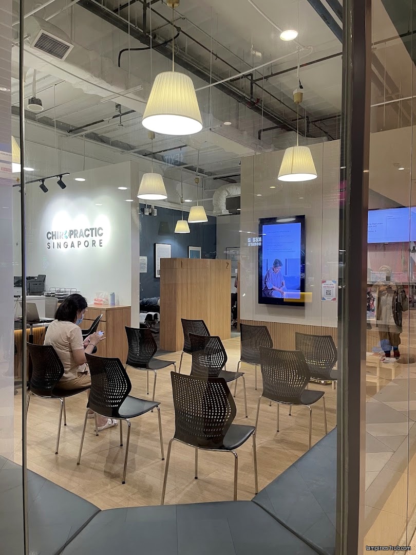 Chiropractic Singapore @ Tampines waiting area with chairs and a patient.