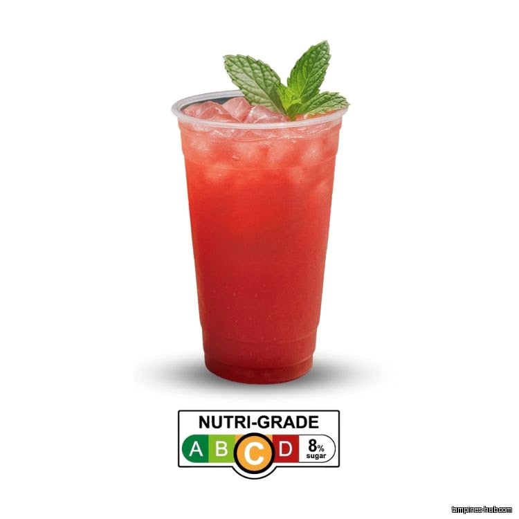 A red drink with ice and mint, featuring a nutri-grade label.