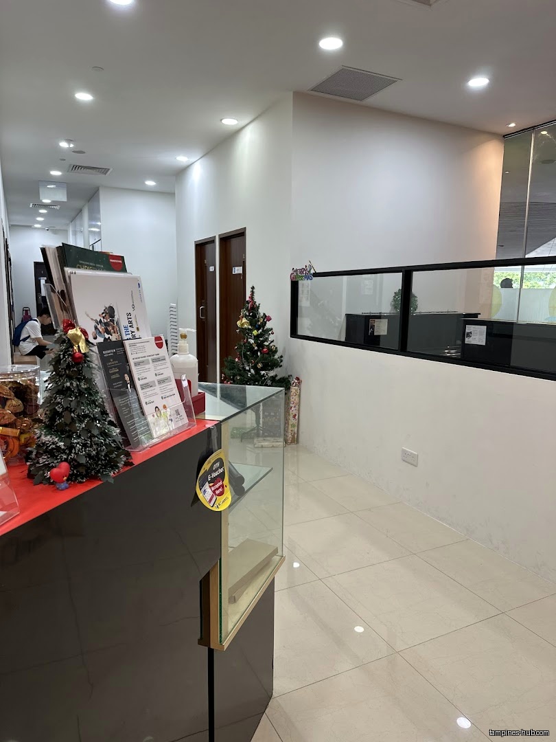 Interior view of Cristofori Music School with a reception desk and Christmas decorations.