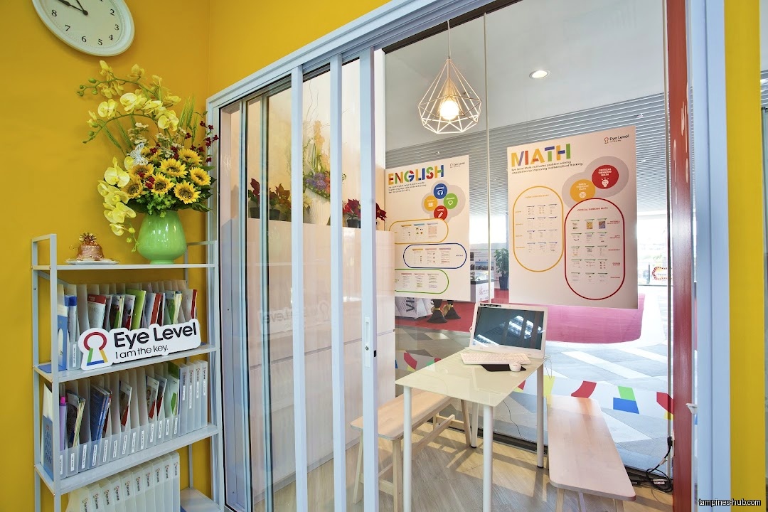 Eye Level Learning Centre interior with posters, desk, and learning materials.
