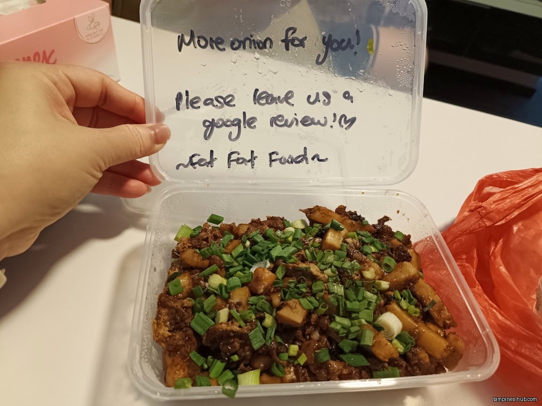 A container of food from Fat Fat Food with a review request.