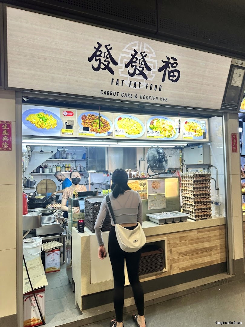 Fat Fat Food shop front with menu and a customer in view.
