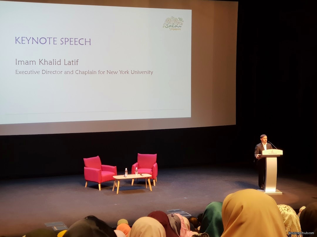 Imam Khalid Latif gives a keynote speech at Festive Arts Theatre.