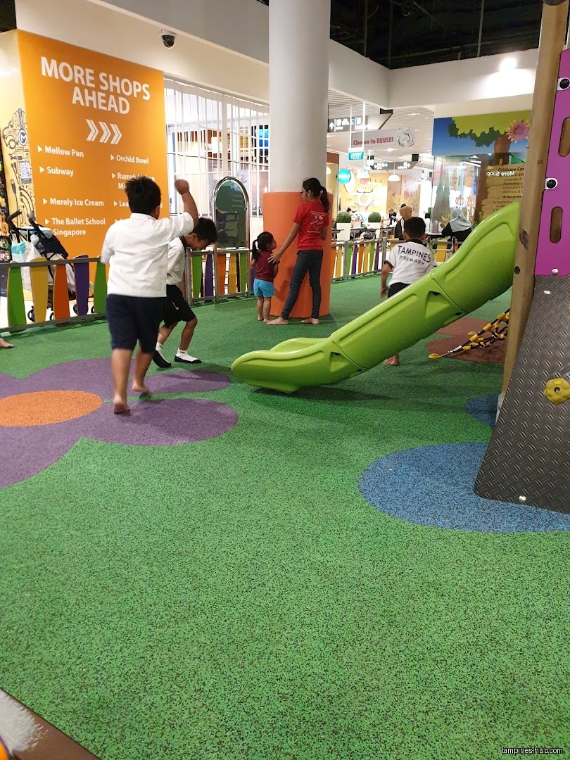 Children play on a playground inside Festive Mall Play Zone.
