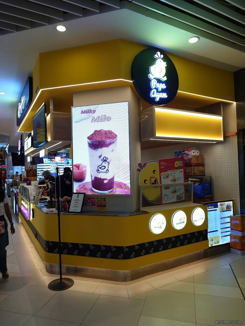Papa Ayam shop front with menu screens and drink advertisements.
