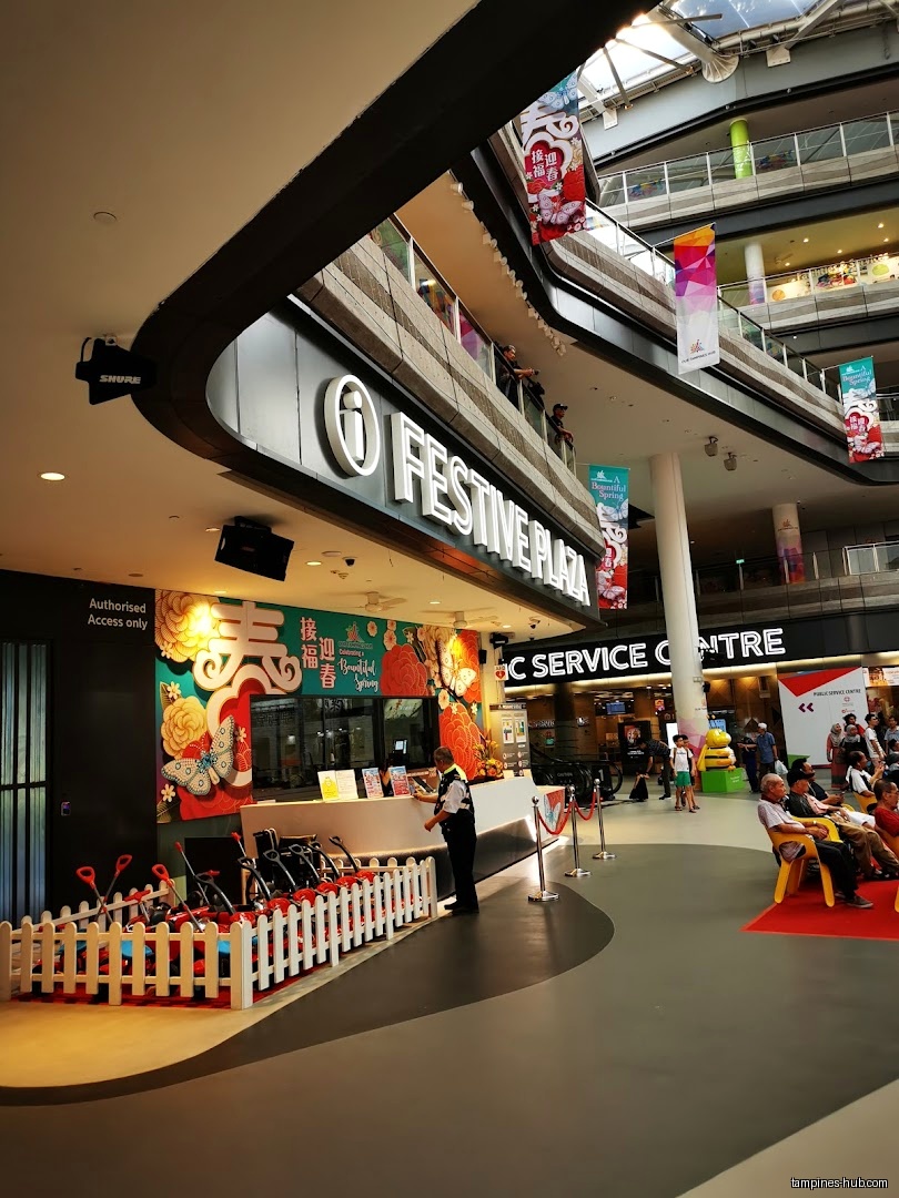 Festive Plaza's customer service centre with strollers and seating area.