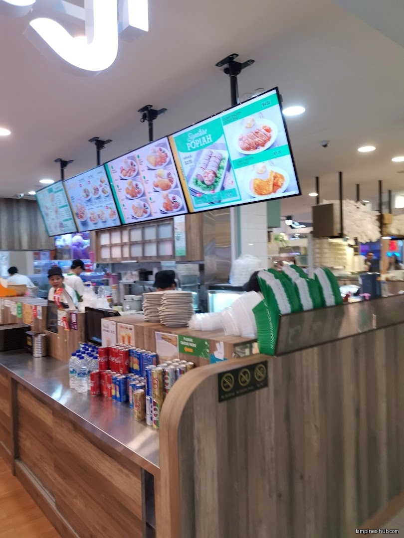 Festive Plaza's counter with menu boards, drinks, and staff visible.