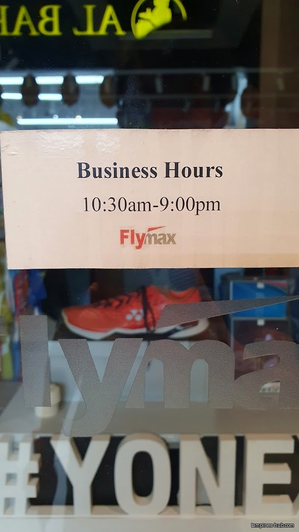 Flymax shop front with business hours sign and shoe display.