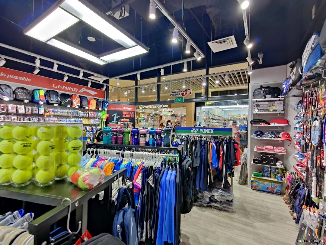 Flymax store interior with sports equipment, apparel, and accessories on display.