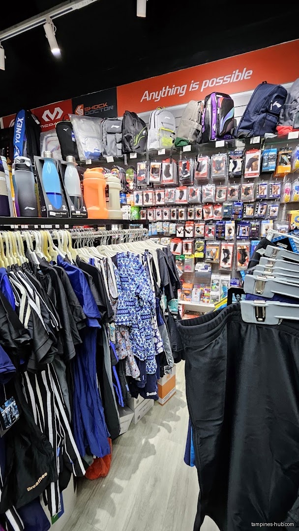 Flymax shop interior with clothing racks and accessories on display.