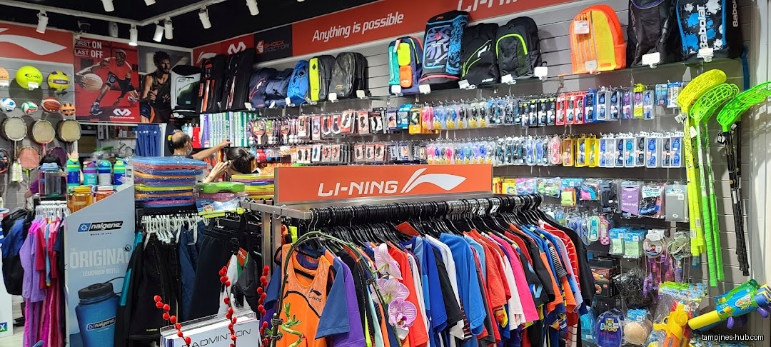 Flymax shop interior with clothing, sports equipment, and accessories on display.