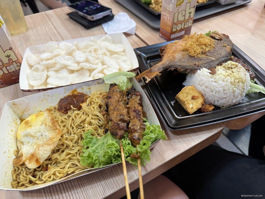 Image shows various dishes from Gado & Grill, including noodles, fish, and satay.