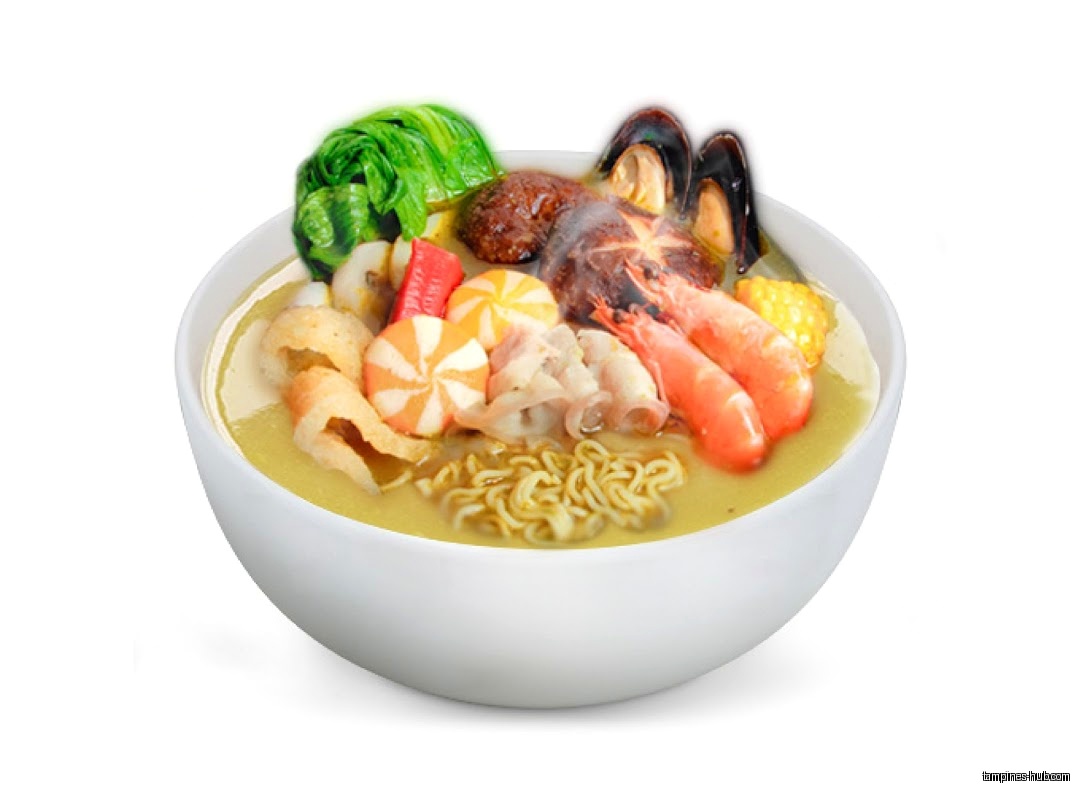 A bowl of Ma La Tang soup with noodles, seafood, and vegetables.