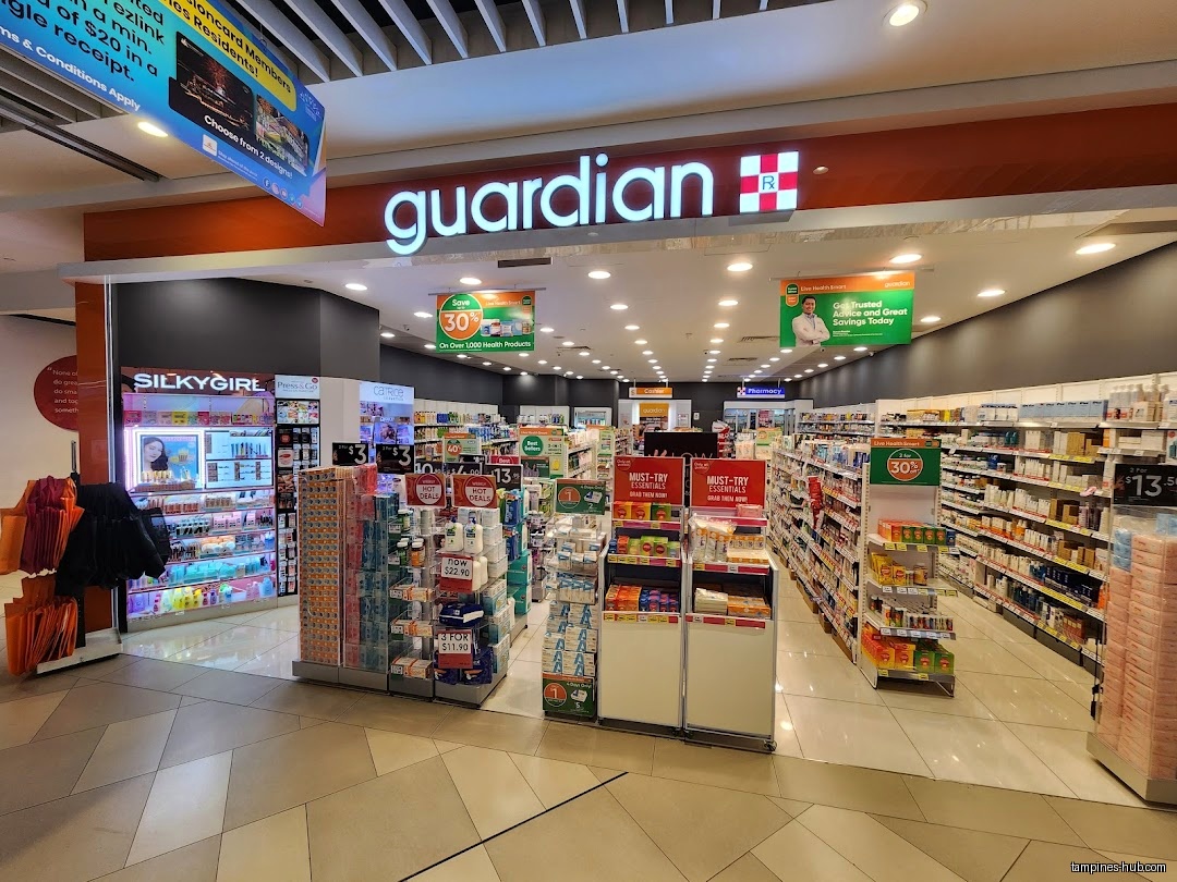 The Guardian Health & Beauty shop front shows aisles of products.