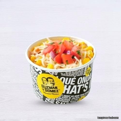 A cup of Guzman y Gomez Mexican Kitchen corn and tomato salad.