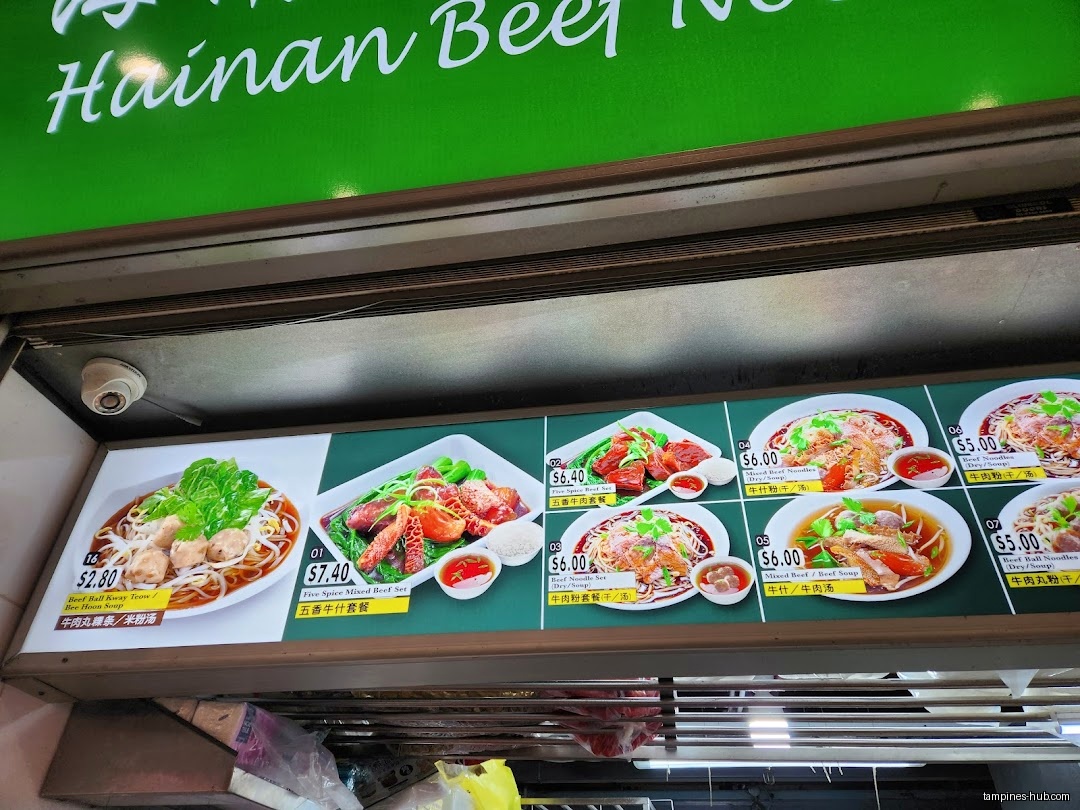 The image shows a menu board with pictures and prices of food items.