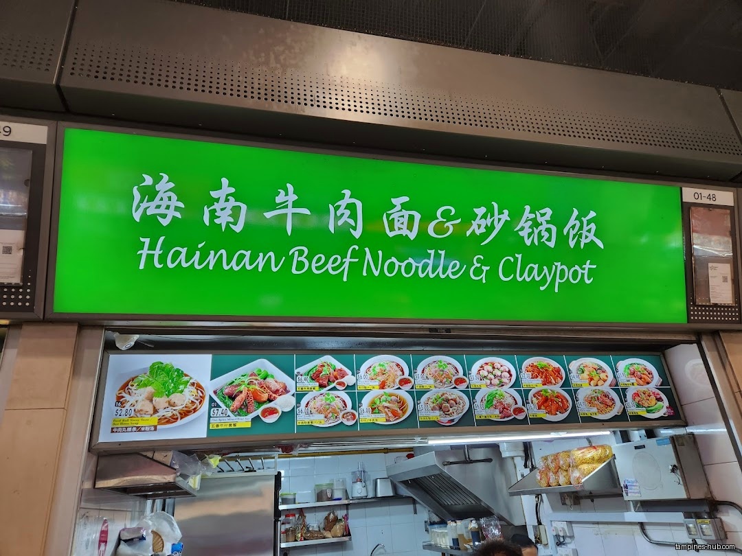 The image shows the menu board of Hainan Beef Noodle & Claypot Rice.