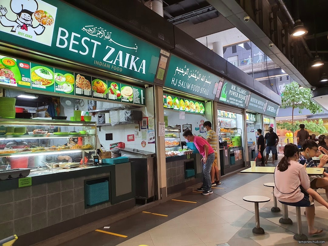 The image shows the front of several food stalls at Hawker Centre.