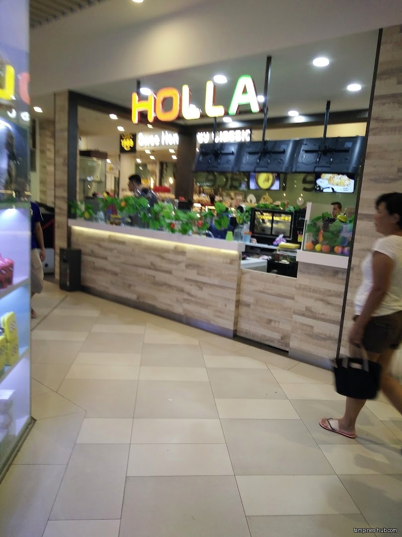 Holla Juice shop front with counter, menu screens, and a customer walking by.