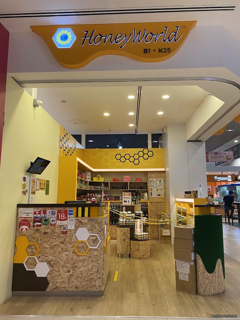 HoneyWorld shop front with yellow and honeycomb design elements.