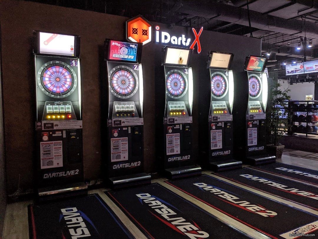 iDarts X shop interior showing multiple electronic dart machines and mats.