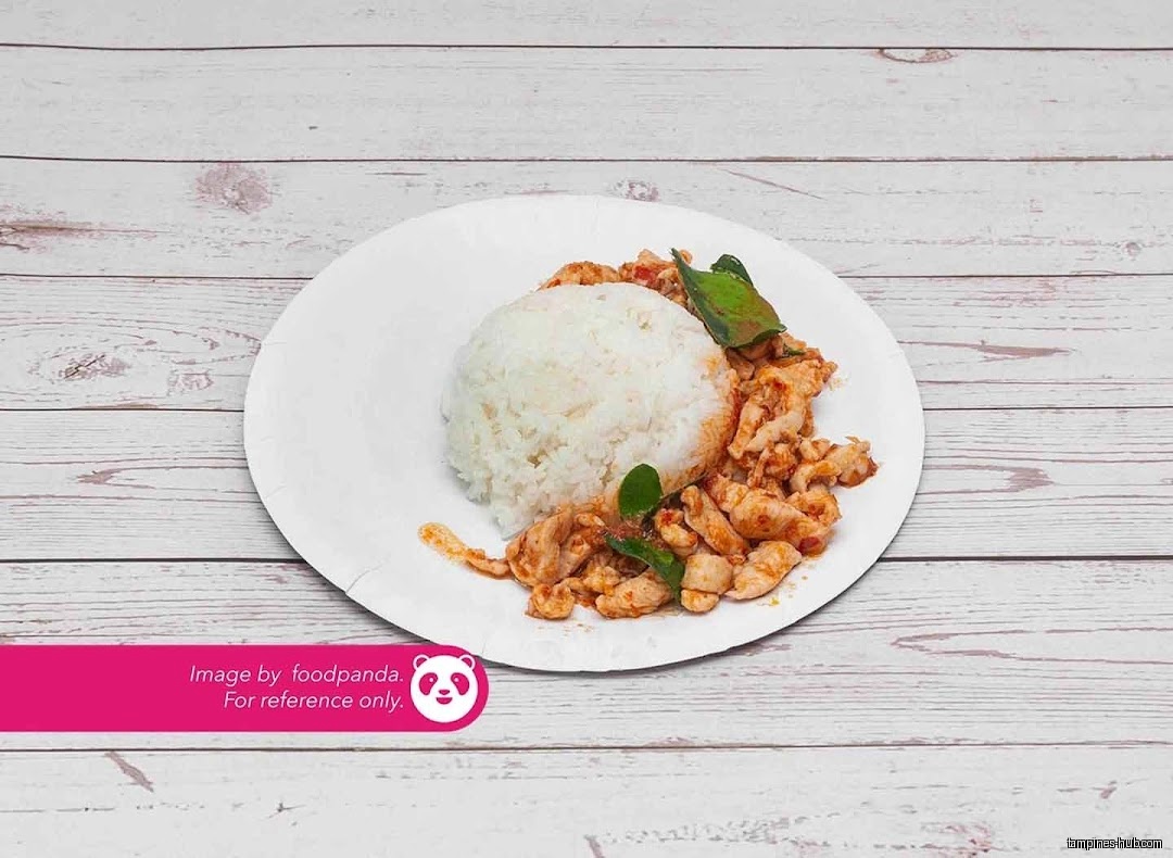 A plate of rice and chicken with basil is shown.