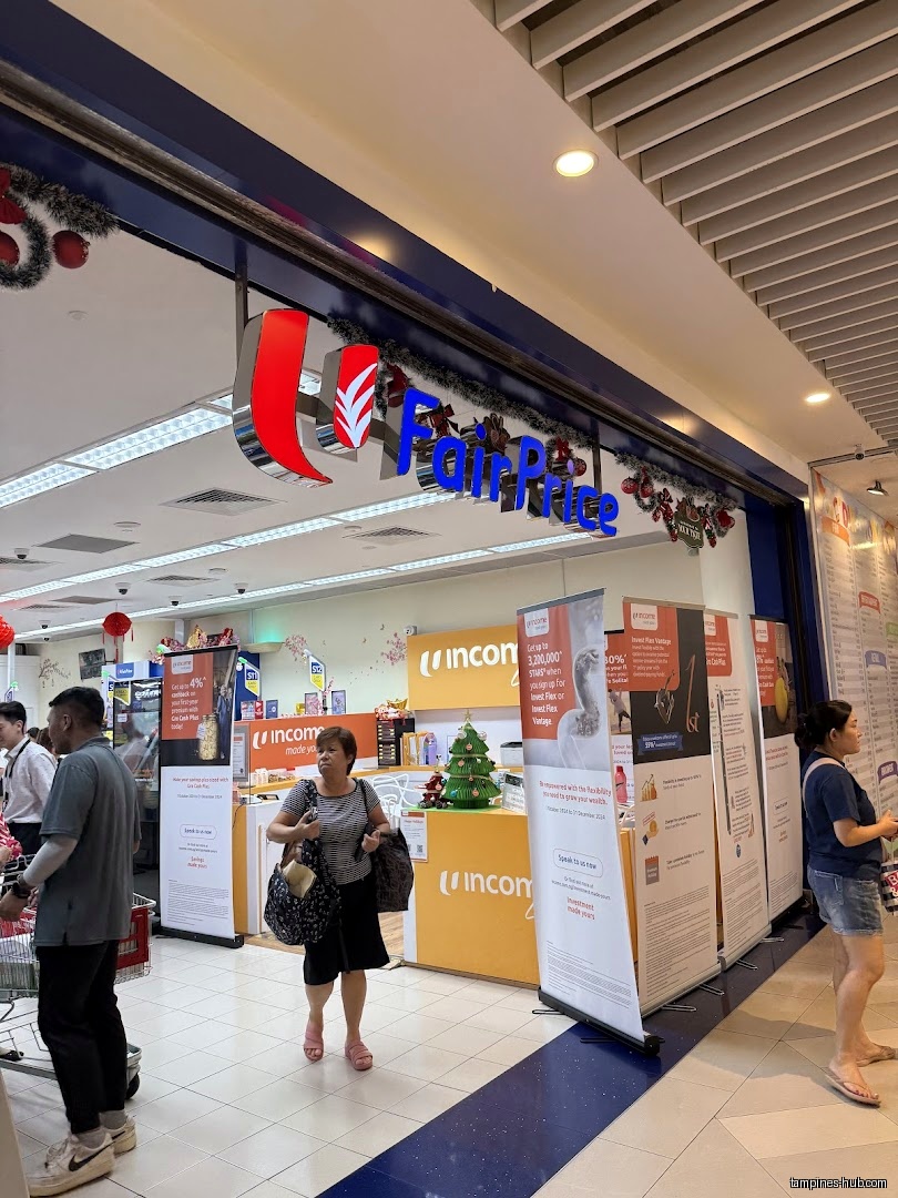 The image shows the entrance of a FairPrice supermarket with people inside.