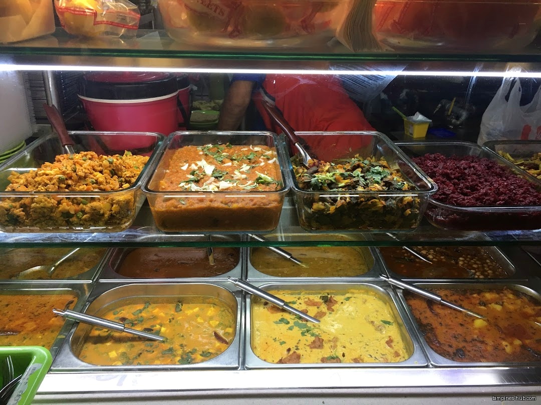 A display case filled with various Indian dishes at Indian Cuisine.