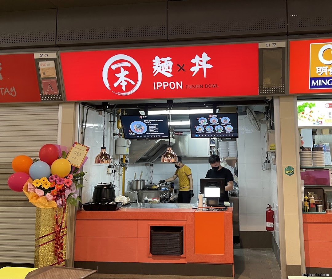 IPPON Fusion Bowl shop front with staff, menu screens, and decorations.