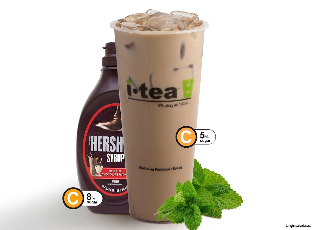 An iTEA drink with Hershey's syrup and mint leaves on a white background.