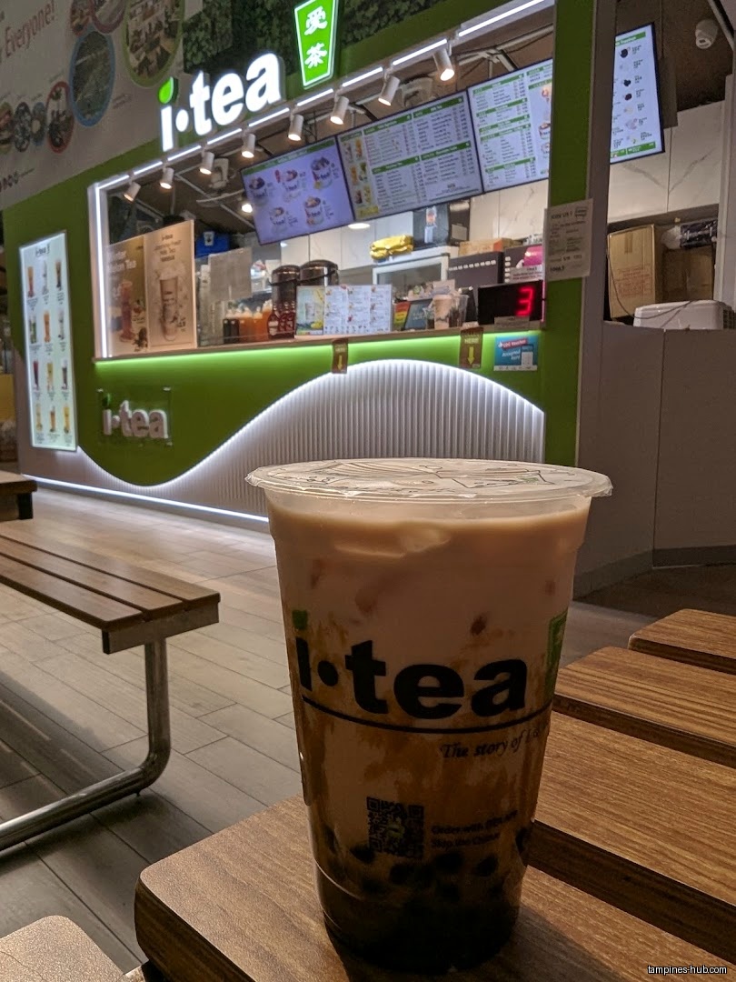 A cup of iTEA bubble tea sits in front of the shop.