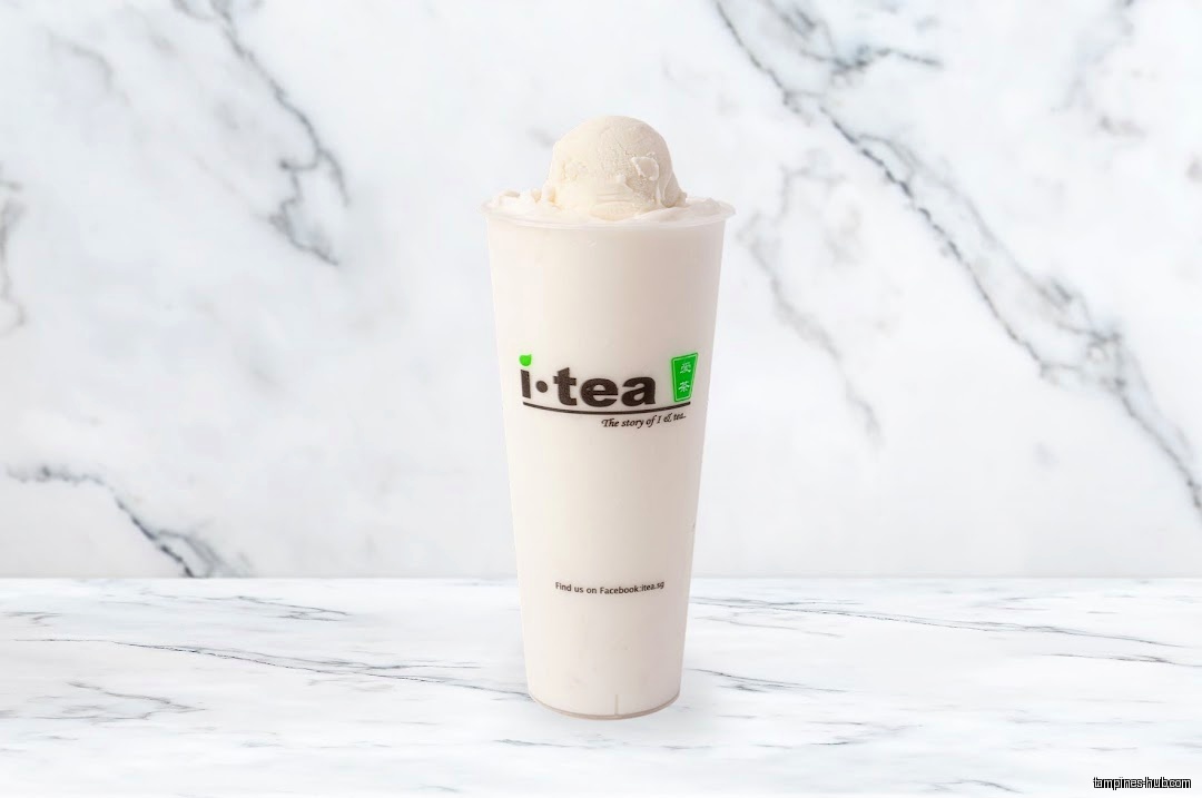 A cup of iTEA drink with a scoop of ice cream on top.