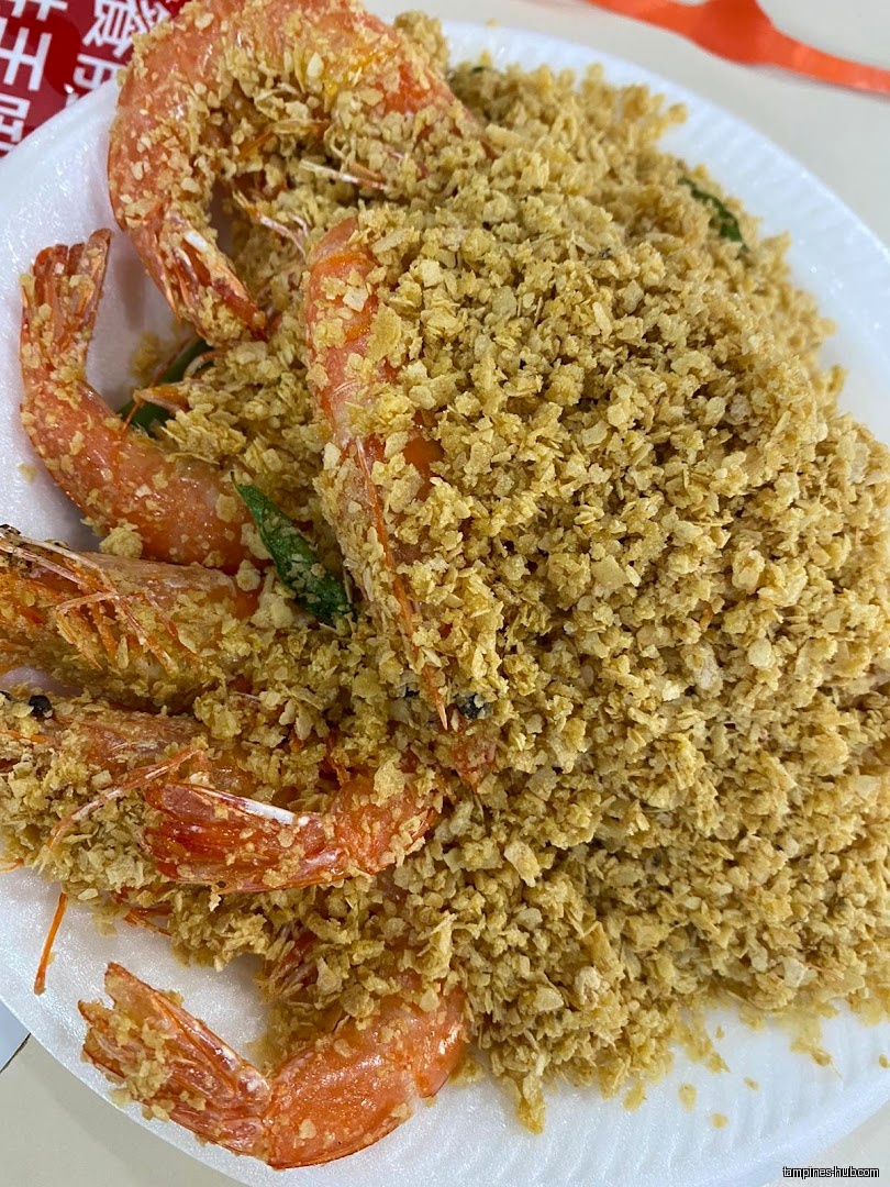 A plate of fried shrimp covered in crispy, golden-brown crumbs.