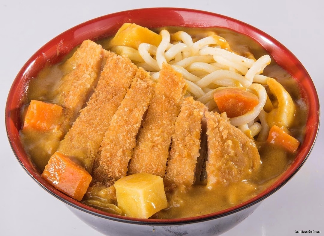 A bowl of Japanese curry udon with tonkatsu and vegetables.
