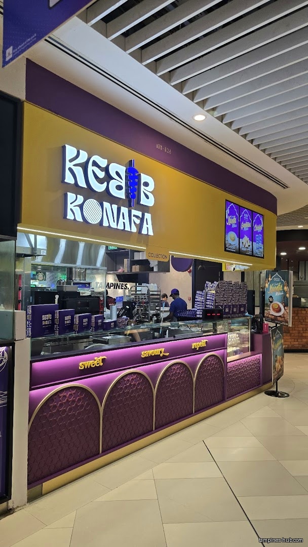Kebab Konafa shop front with purple and gold decor in a mall.