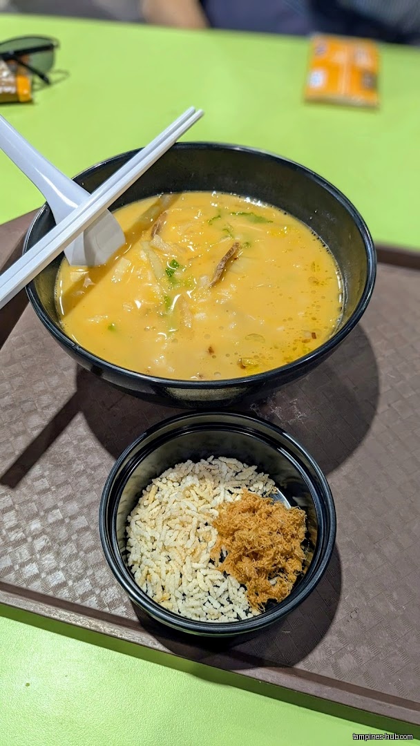 A bowl of soup and a bowl of rice with toppings are shown.